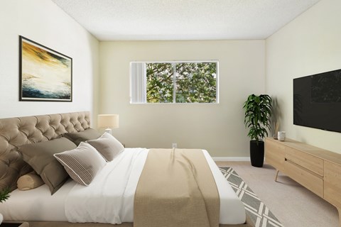 A bedroom with a large bed and a painting on the wall.