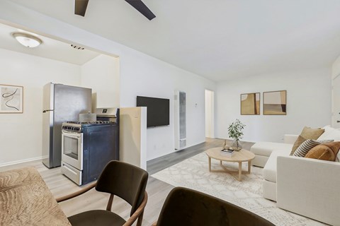 A modern living room with a brown chair and a white couch.
