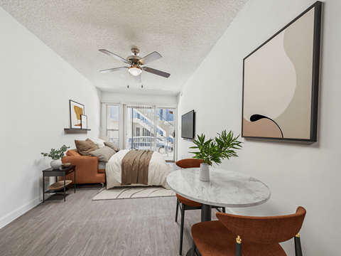 A living room with a brown chair and a white table.