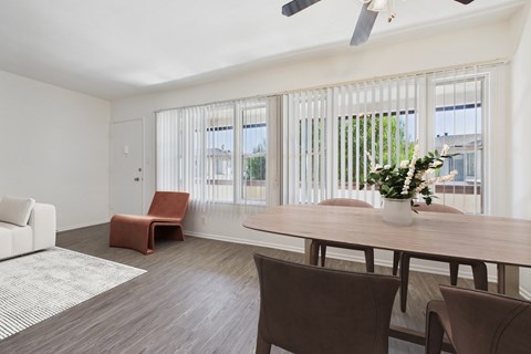A room with a brown chair and a brown table.