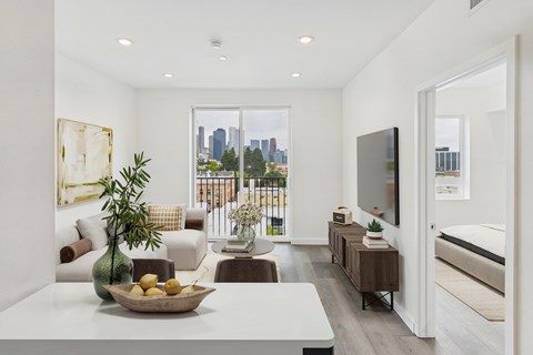 A modern living room with a view of the city.