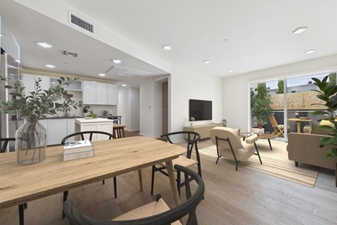 A modern dining area with a wooden table and chairs.