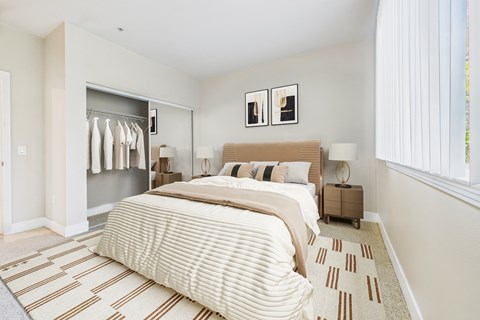 A bedroom with a large bed and a wardrobe.