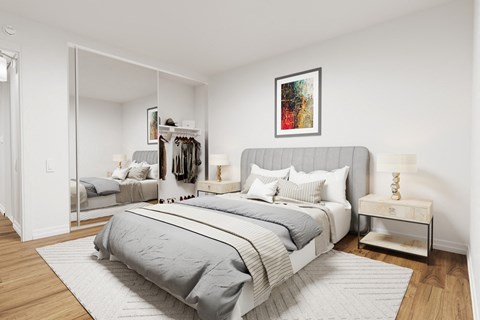 a bedroom with a bed and a mirror