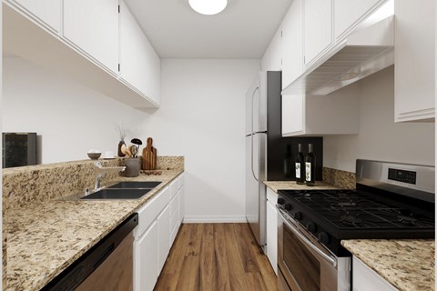 A kitchen with a black stove top oven and a black refrigerator.
