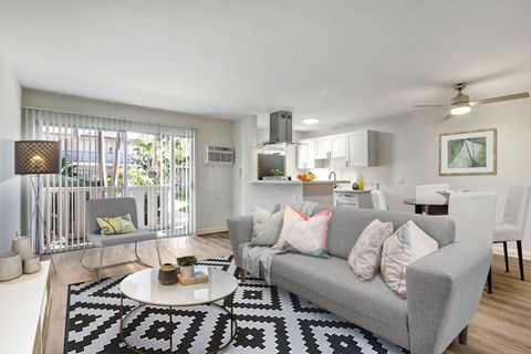 A living room with a grey couch and a coffee table.