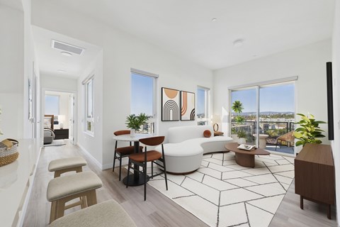 A living room with a white sofa and a coffee table.