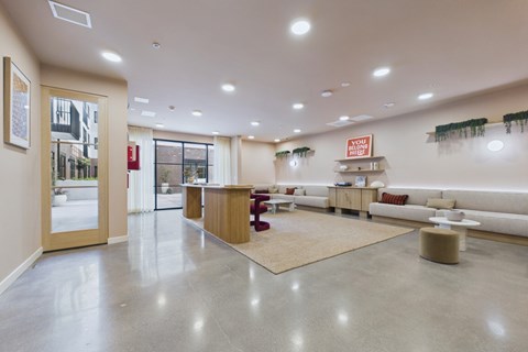 A spacious waiting area with a reception desk and seating.