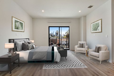 a bedroom with a bed and a chair in a room