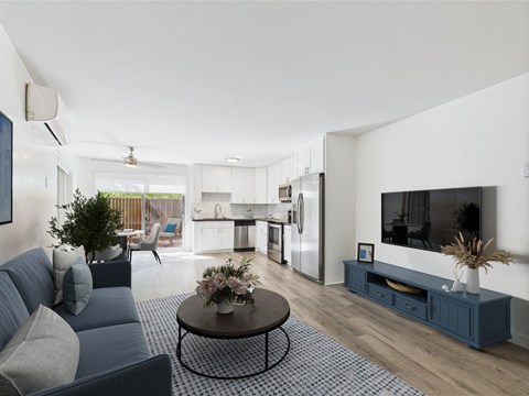 A modern living room with a grey sofa and a coffee table.