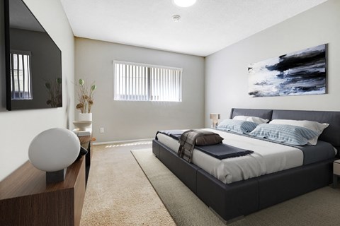 A modern bedroom with a large bed and a large painting on the wall.