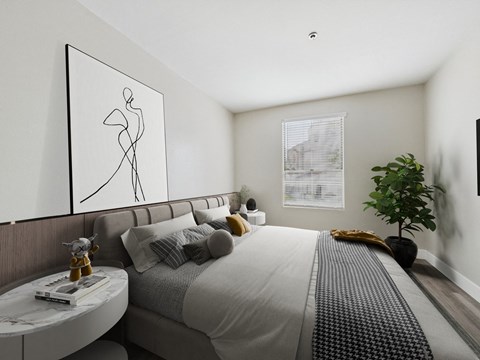 A modern bedroom with a large bed and a framed abstract art piece on the wall.