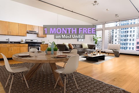 A modern living room with a dining table and chairs is on sale for 1 month free on most units.
