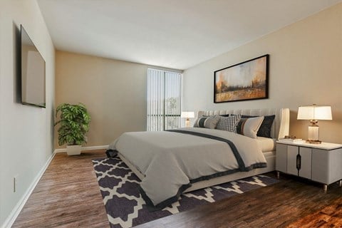 a bedroom with a bed and a window