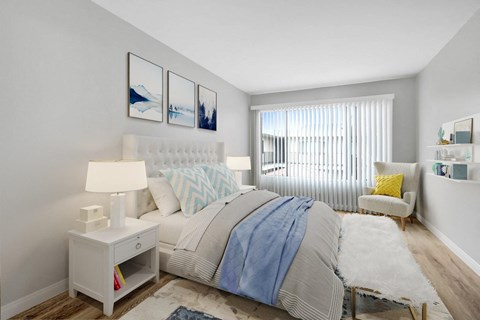 a bedroom with a large bed and a window