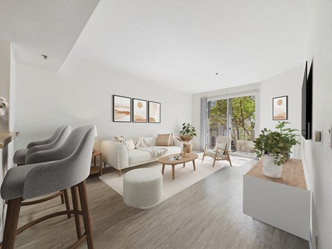 A living room with a grey chair and a white sofa.