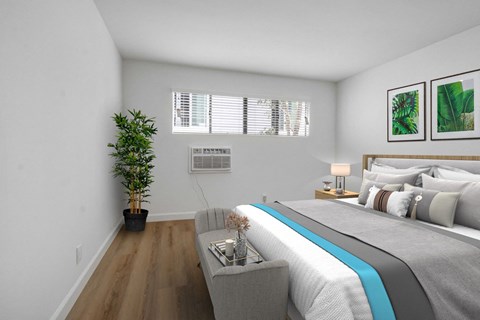 a bedroom with white walls and a large bed with a blue blanket