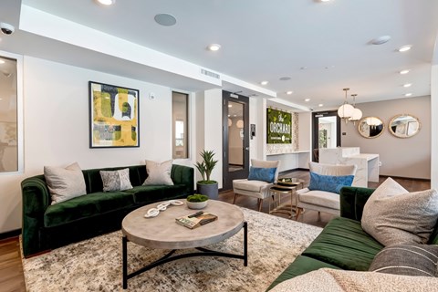 A living room with a green couch and a coffee table.