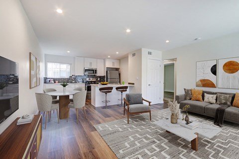 A modern living room with a grey sofa and a coffee table.