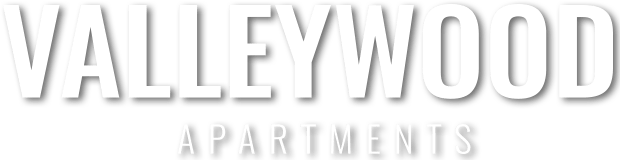 The image is a logo for Valleywood Apartments.