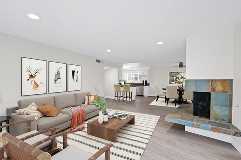A living room with a grey couch and a coffee table.
