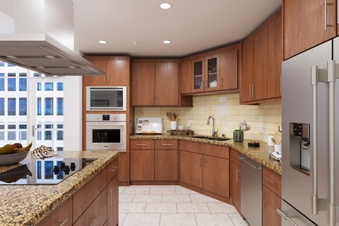 A kitchen with wooden cabinets and granite countertops.