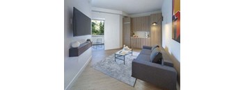a living room with a couch and a television at Wilshire Margot, California, 90024