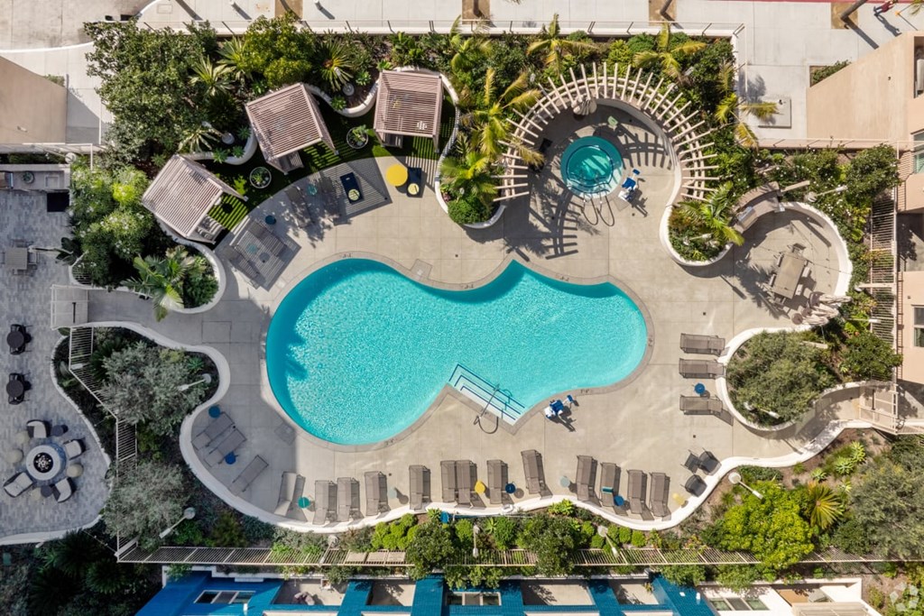 an overhead view of a swimming pool and a resort pool