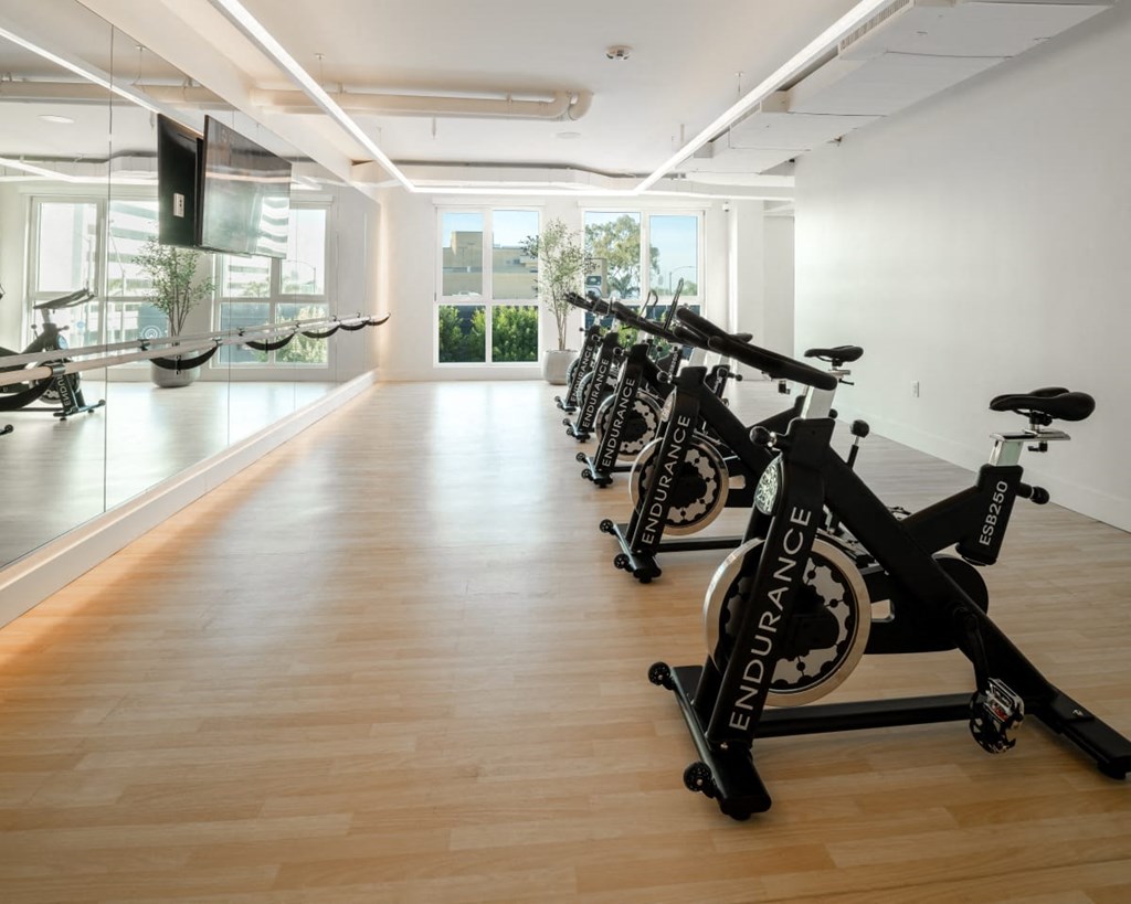 a room with bikes on display in a museum