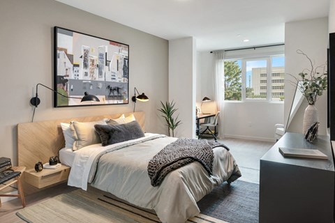 a bedroom with a bed and a window