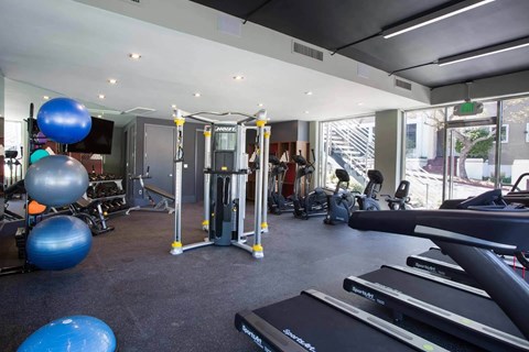 Fitness center at 888 Hilgard apartments in Westwood Los Angeles with modern gym equipment near UCLA