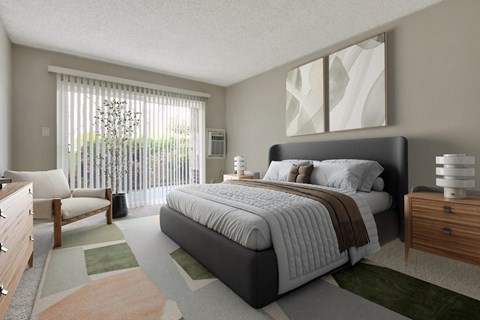A bedroom with a large bed and a chair by the window.