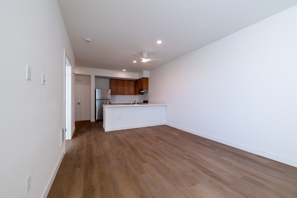 A room with wooden floors and white walls.