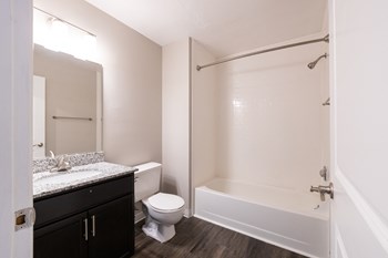 Full Bath in the Two Bedroom One Bath Apartment at Woodbridge Apartments Bloomington - Photo Gallery 57