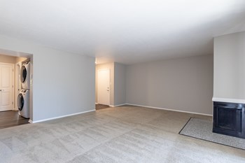 Spacious Living Room with a Fireplace in the Two Bedroom One Bath Apartment at Woodbridge Apartments Bloomington - Photo Gallery 58