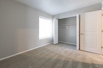 Second Bedroom with Closet in the Two Bedroom One Bath Apartment at Woodbridge Apartments Bloomington - Photo Gallery 55