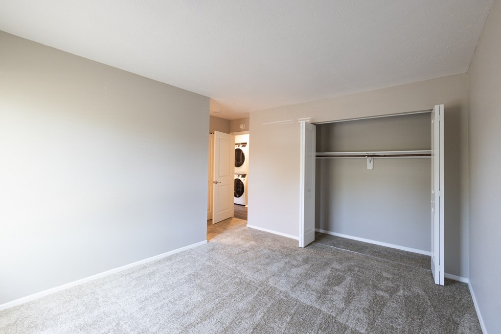 Spacious Primary Bedroom in the Two Bedroom Two Bath Apartment at Woodbridge Apartments Bloomington