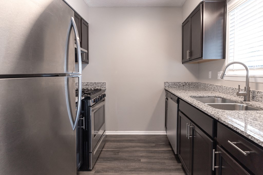Kitchen with Stainless Steel Appliances in the Two Bedroom Townhome at Woodbridge Apartments Bloomington