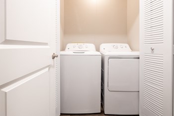 Laundry Area in the Two Bedroom Townhome at Woodbridge Apartments Bloomington - Photo Gallery 47