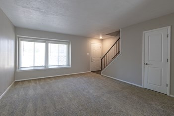 Spacious Living Room in the Two Bedroom Townhome at Woodbridge Apartments Bloomington - Photo Gallery 49