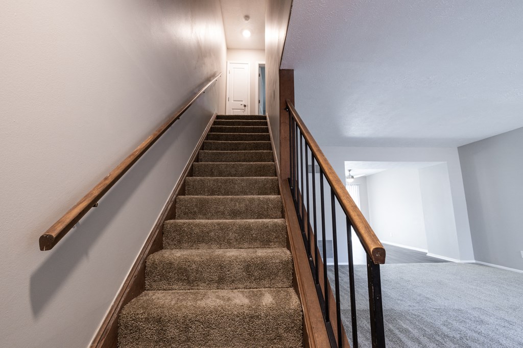 Stairway in the Two Bedroom Townhome at Woodbridge Apartments Bloomington