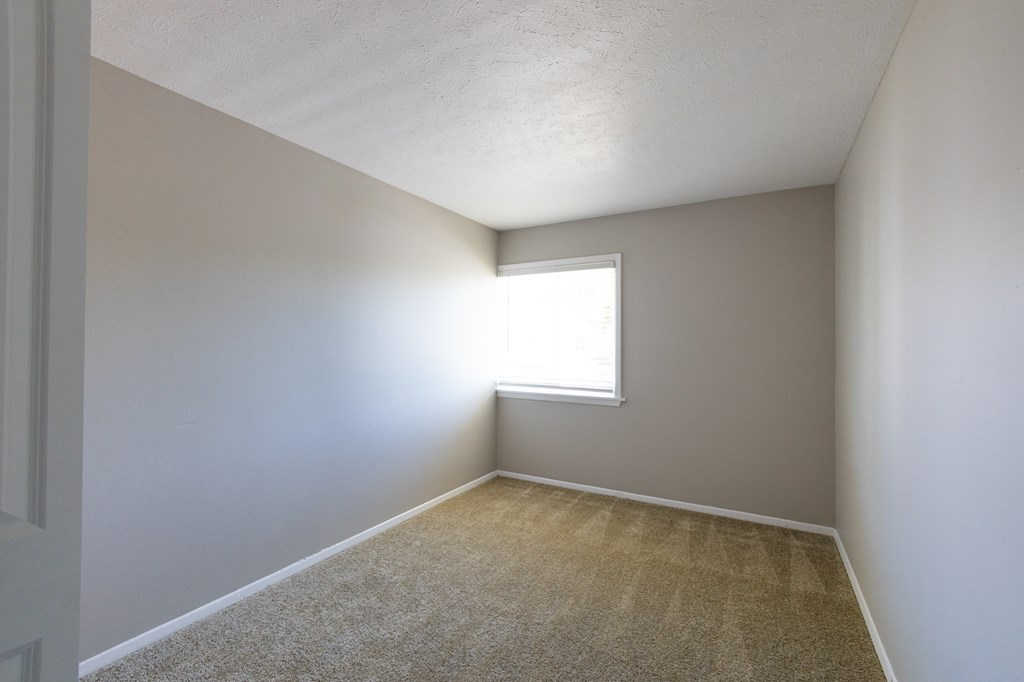 Third Bedroom with a Window in the Three Bedroom Townhome at Woodbridge Bloomington