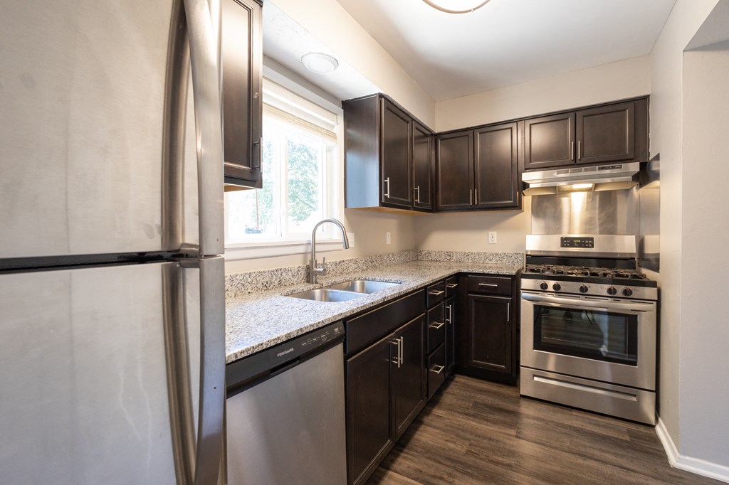 Kitchen with Stainless Steel Appliances in the Three Bedroom Townhome at Woodbridge Apartments Bloomington