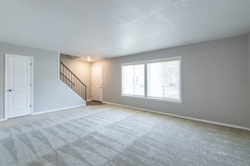 Spacious Living Room in the Three Bedroom Townhome at Woodbridge Apartments Bloomington - Photo Gallery 38