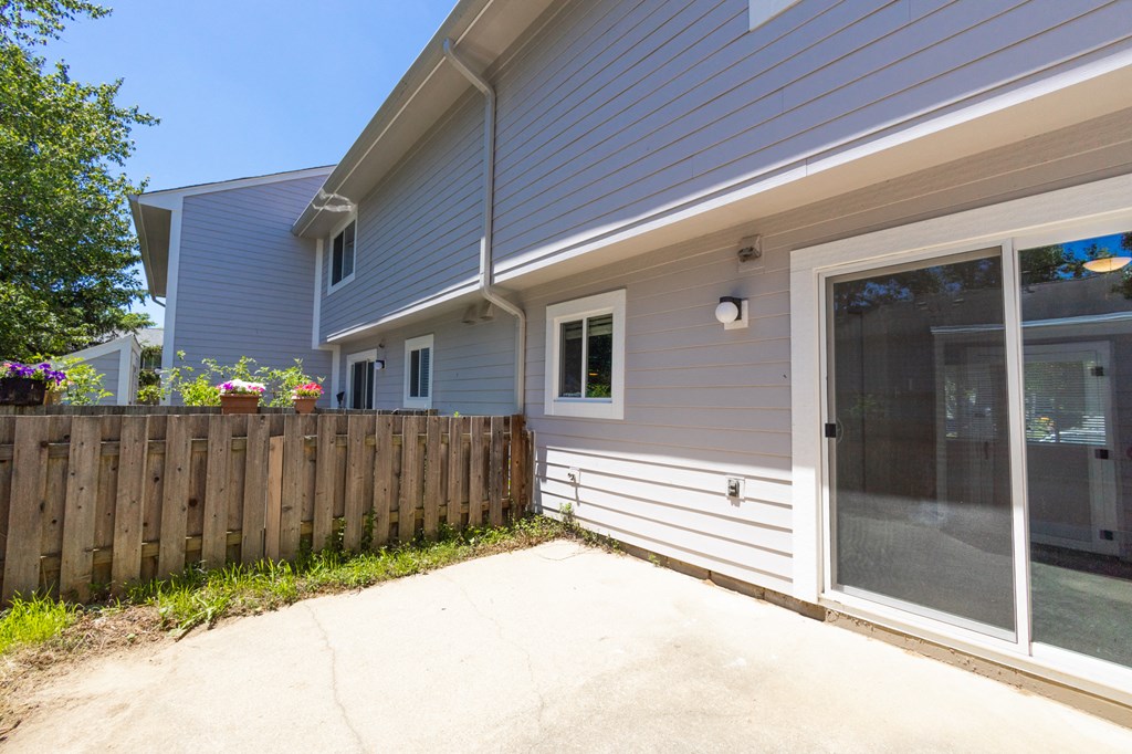 Enclosed Patio in the Three Bedroom Townhome at Woodbridge Apartments Bloomington
