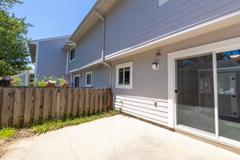 Enclosed Patio in the Three Bedroom Townhome at Woodbridge Apartments Bloomington - Photo Gallery 37