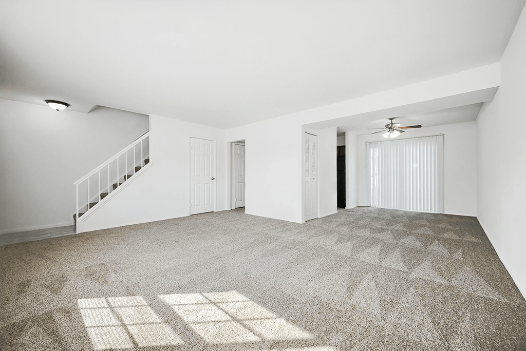 Living room in a 3-bedroom townhome at Ashton Pointe Apartments.