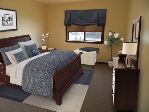 A bedroom with a large bed and a nightstand with a lamp.