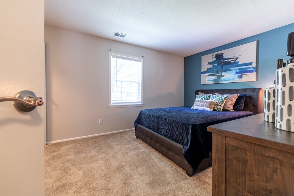 Bedroom at Ashton Brook Apartments with a large window