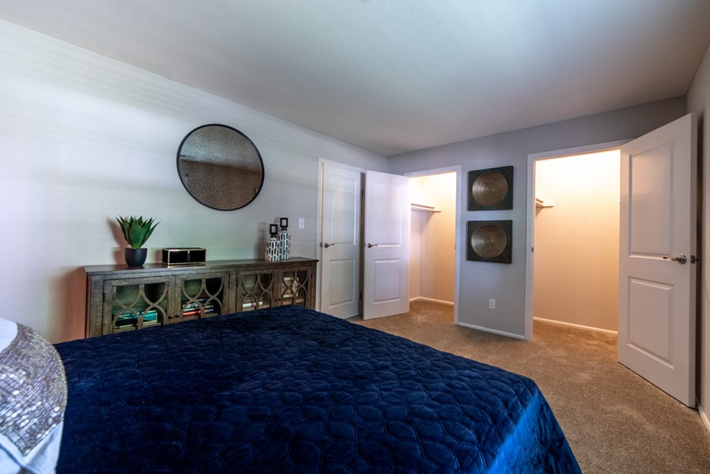 Bedroom closet in an apartment at Ashton Brook, featuring spacious storage with shelves and hanging space.